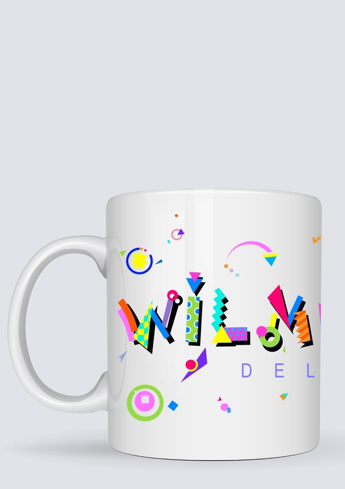 White mug with colorful geometric design on a white background