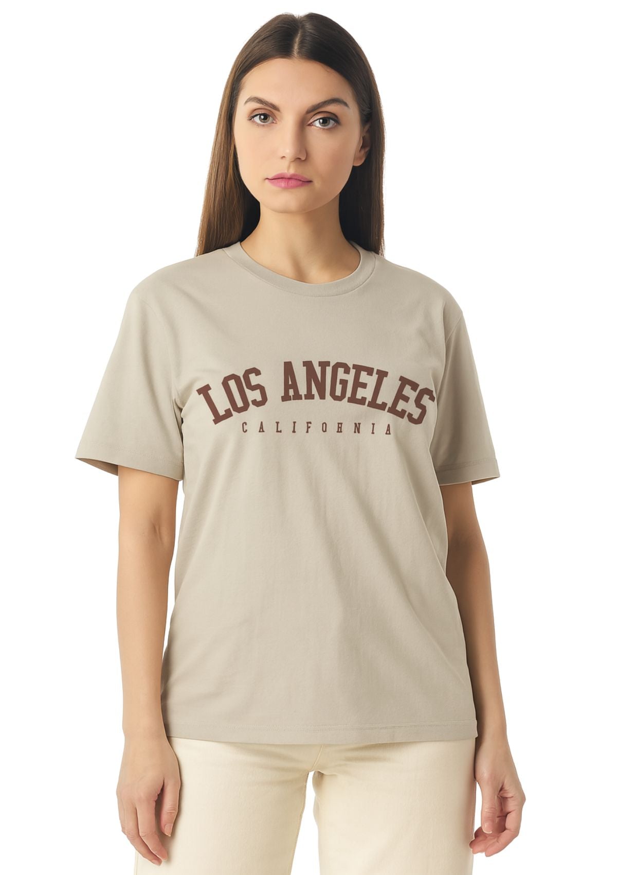 Woman wearing a tan t-shirt with 'Los Angeles California' text 